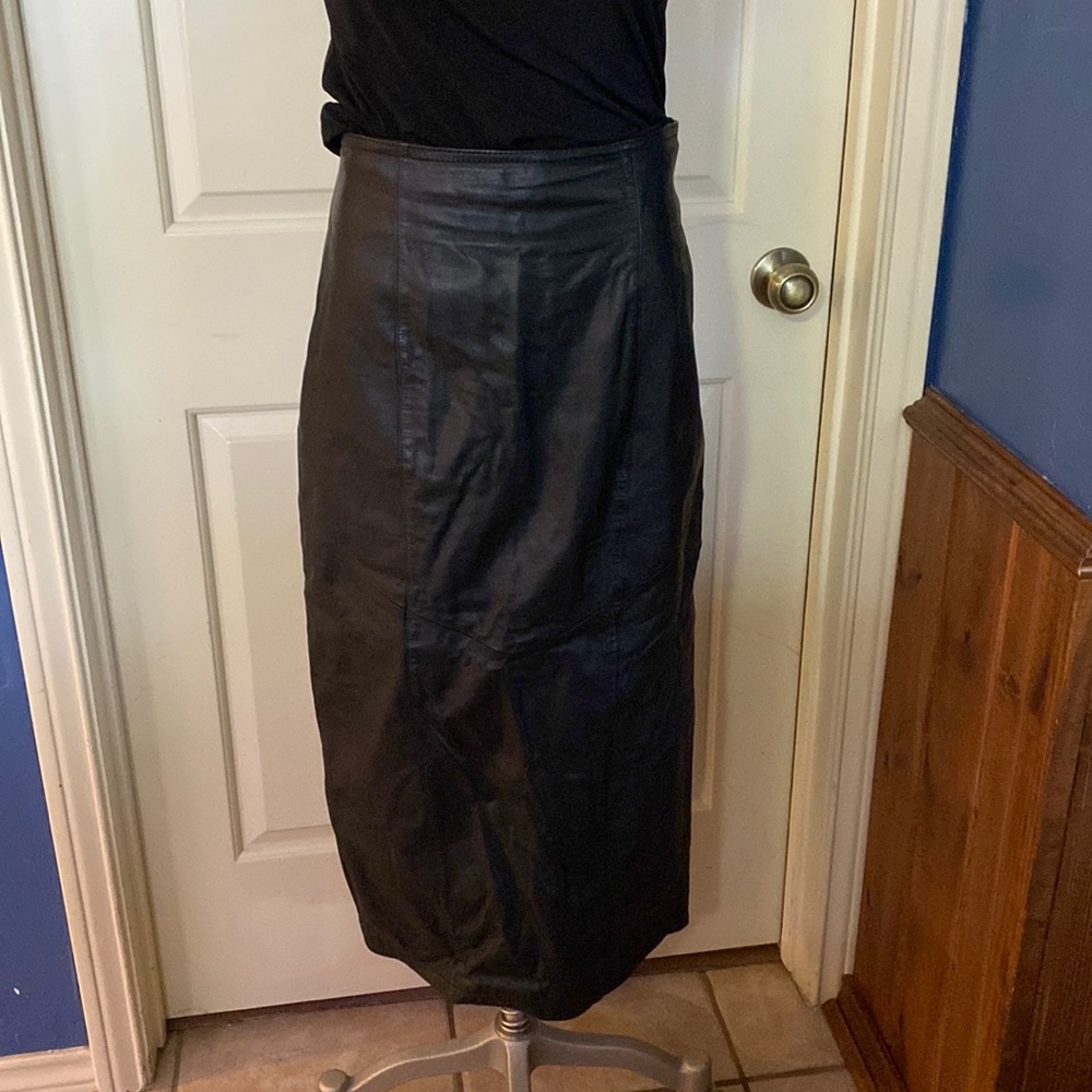 Black leather skirt, with kick pleat and back zipper